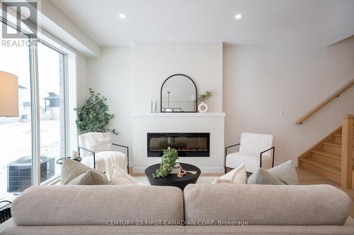 4273 Calhoun Way, London South (South V), ON - Indoor Photo Showing Living Room With Fireplace