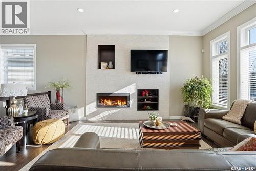 4506 Sandpiper Crescent E, Regina, SK - Indoor Photo Showing Living Room With Fireplace