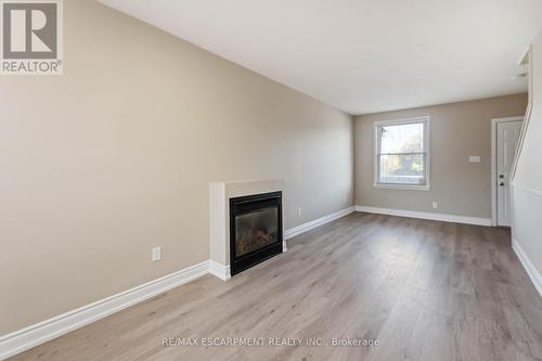 187 Barton Street W, Hamilton, ON - Indoor Photo Showing Living Room With Fireplace