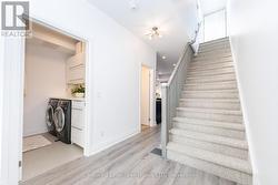 Luxurious laundry room with quartz counter & sink - 