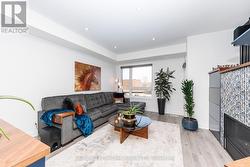 Media room with wet bar, gas fireplace and balcony - 