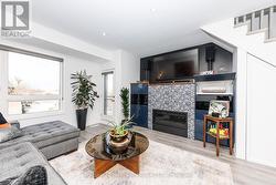 Media room with wet bar, gas fireplace and balcony - 