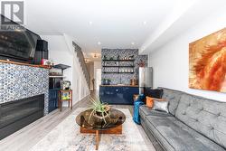 Media room with wet bar, gas fireplace and balcony - 