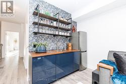 Media room wet bar with bar fridge - 