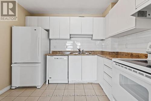 Sizeable kitchen space with lovely backsplash. - 502 - 7 Gale Crescent, St. Catharines (E. Chester), ON - Indoor Photo Showing Kitchen With Double Sink
