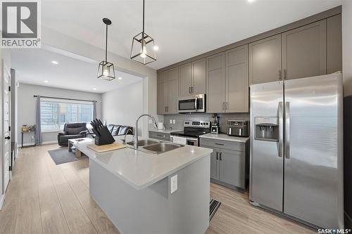 608 Brighton Gate, Saskatoon, SK - Indoor Photo Showing Kitchen With Stainless Steel Kitchen With Double Sink With Upgraded Kitchen