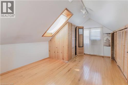 Bonus room with a skylight, light wood-style flooring, and lofted ceiling - 84 South Oval, Hamilton, ON - Indoor Photo Showing Other Room