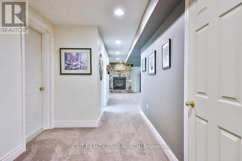 28 Nicholson Crescent, Springwater, ON - Indoor Photo Showing Other Room With Fireplace