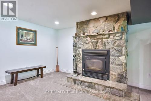 28 Nicholson Crescent, Springwater, ON - Indoor Photo Showing Living Room With Fireplace