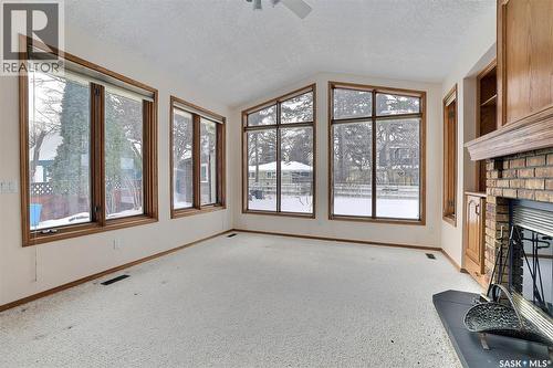 14 Deergrove Crescent, Regina, SK - Indoor Photo Showing Other Room With Fireplace