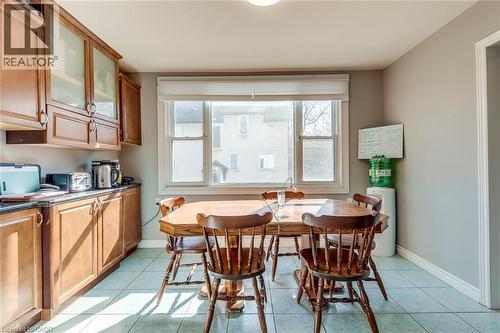 Dining space featuring baseboards and light tile patterned floors - 142 Ewen Road, Hamilton, ON - Indoor Photo Showing Other Room