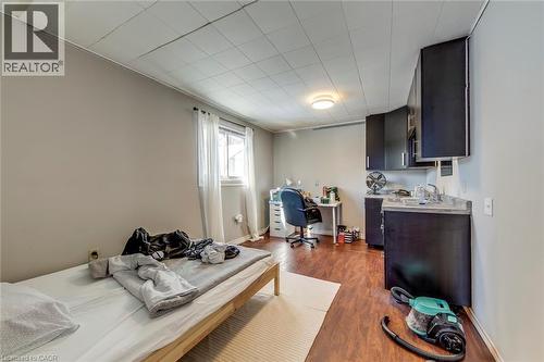 Bedroom featuring a desk and dark wood-style flooring - 142 Ewen Road, Hamilton, ON - Indoor