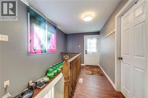 Corridor featuring an upstairs landing and dark wood-style floors - 142 Ewen Road, Hamilton, ON - Indoor Photo Showing Other Room