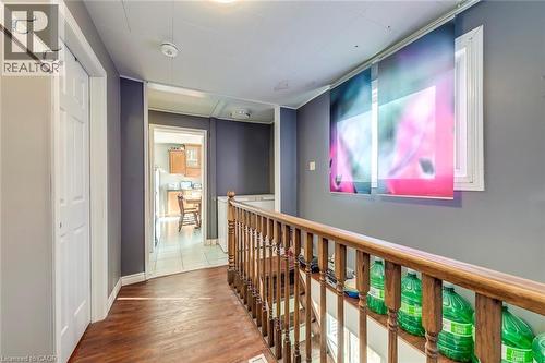 Corridor featuring wood finished floors and an upstairs landing - 142 Ewen Road, Hamilton, ON - Indoor Photo Showing Other Room