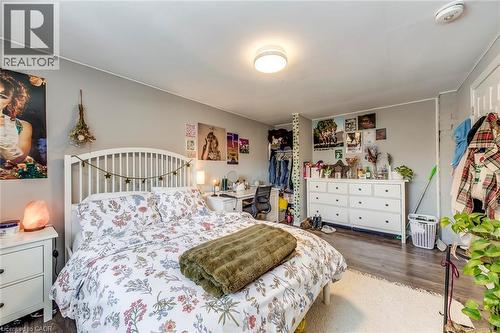 Bedroom featuring dark wood-type flooring - 142 Ewen Road, Hamilton, ON - Indoor Photo Showing Bedroom
