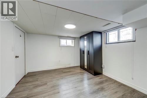 Below grade area featuring light wood-type flooring and baseboards - 142 Ewen Road, Hamilton, ON - Indoor