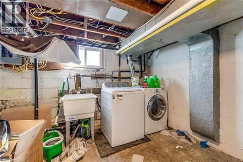 Laundry area featuring washing machine and clothes dryer and concrete floors - 142 Ewen Road, Hamilton, ON - Indoor Photo Showing Laundry Room