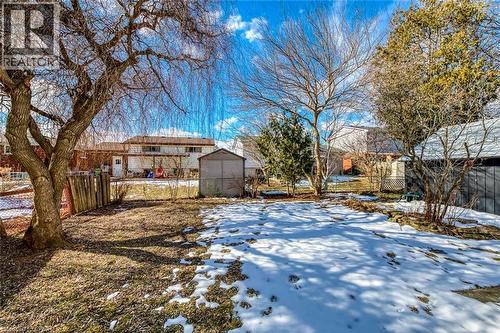 Yard layered in snow featuring a storage shed - 142 Ewen Road, Hamilton, ON - Outdoor