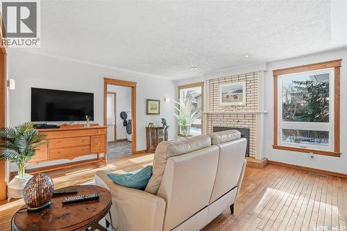 2423 Strathmore Place E, Regina, SK - Indoor Photo Showing Living Room With Fireplace