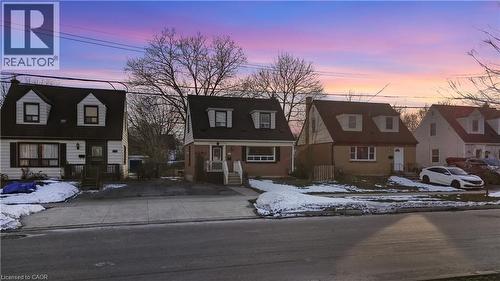 Cape cod-style house featuring a residential view and a gambrel roof - 776 Britannia Avenue, Hamilton, ON - Outdoor With Facade