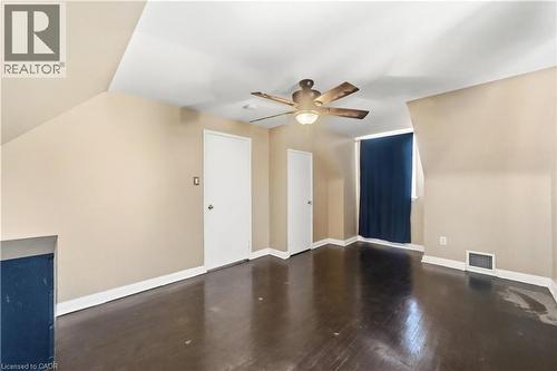 Bonus room featuring ceiling fan, dark wood finished floors, and vaulted ceiling - 776 Britannia Avenue, Hamilton, ON - Indoor Photo Showing Other Room
