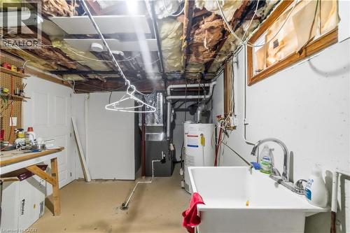 Unfinished basement with water heater and heating unit - 776 Britannia Avenue, Hamilton, ON - Indoor Photo Showing Basement