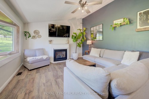 22 Smith Drive, Mapleton, ON - Indoor Photo Showing Living Room With Fireplace