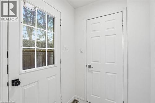 Side entrance to left, large storage door in front, garage entrance to left of photo. - 14 Basin Crescent, Hamilton, ON - Indoor Photo Showing Other Room
