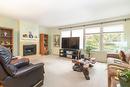 2-1209 Brookside Avenue, Kelowna, BC  - Indoor Photo Showing Living Room With Fireplace 