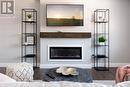 Photo is representation of Builders work - 194 Bridge Crescent, Minto, ON  - Indoor Photo Showing Living Room With Fireplace 