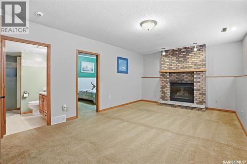 210 Brunst Crescent, Saskatoon, SK - Indoor Photo Showing Living Room With Fireplace