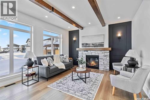 327 Woolf Bay, Saskatoon, SK - Indoor Photo Showing Living Room With Fireplace