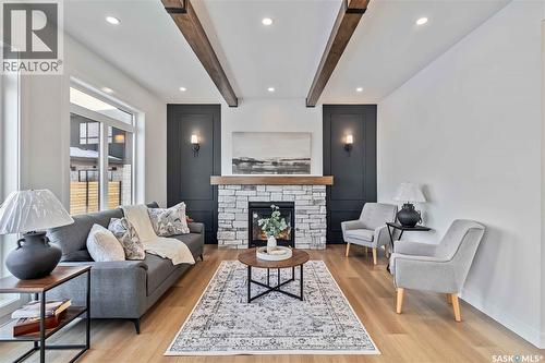 327 Woolf Bay, Saskatoon, SK - Indoor Photo Showing Living Room With Fireplace