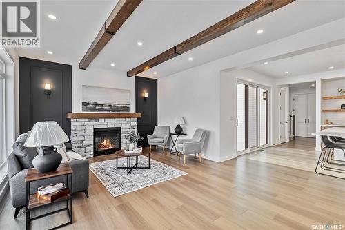 327 Woolf Bay, Saskatoon, SK - Indoor Photo Showing Living Room With Fireplace