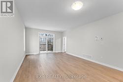 Patio doors lead to an upper level deck - 