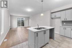 Open concept kitchen, dining, living space - 