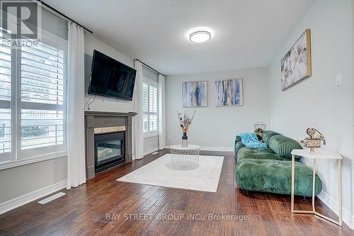 52 Whitewater Street, Whitby, ON - Indoor Photo Showing Living Room With Fireplace