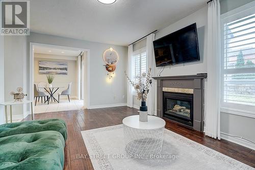 52 Whitewater Street, Whitby, ON - Indoor Photo Showing Living Room With Fireplace