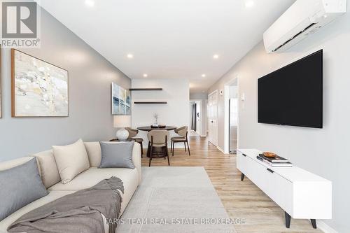 Virtually Staged - 34 - 120 D'Ambrosio Drive, Barrie, ON - Indoor Photo Showing Living Room