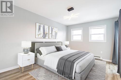 Virtually Staged - 34 - 120 D'Ambrosio Drive, Barrie, ON - Indoor Photo Showing Bedroom