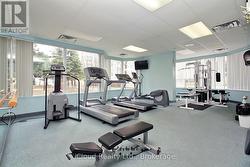 Exercise room with lots of machines. - 
