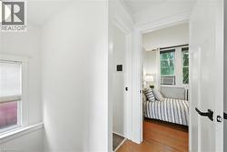 Hall featuring wood finished floors - 