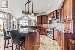 Centre Island and tons of Oak Cabinets - 