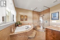 Ensuite with large Soaker Tub and Glass Shower - 