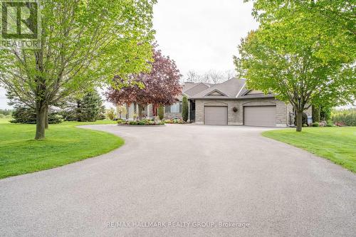 Wide Wrap Around Driveway with 3 Car Garage - 6980 Mansfield Road, Ottawa, ON - Outdoor