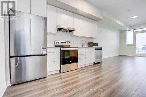 215 - 3200 William Coltson Avenue, Oakville, ON - Indoor Photo Showing Kitchen With Stainless Steel Kitchen
