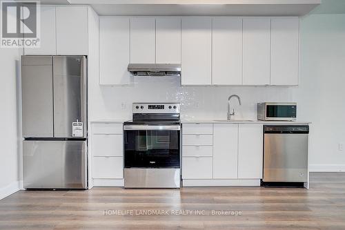 215 - 3200 William Coltson Avenue, Oakville, ON - Indoor Photo Showing Kitchen With Stainless Steel Kitchen