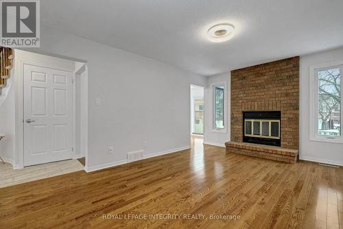 MAIN FLOOR FAMILY ROOM - 2177 Lenester Avenue, Ottawa, ON - Indoor Photo Showing Living Room With Fireplace