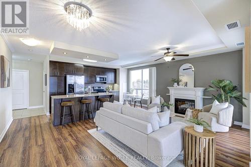 608 - 539 Belmont Avenue W, Kitchener, ON - Indoor Photo Showing Living Room With Fireplace