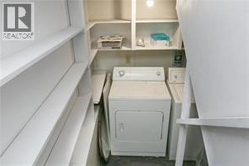 photos was taken prior to tenants moving in - 130 Dysart Road, Kelowna, BC - Indoor Photo Showing Laundry Room